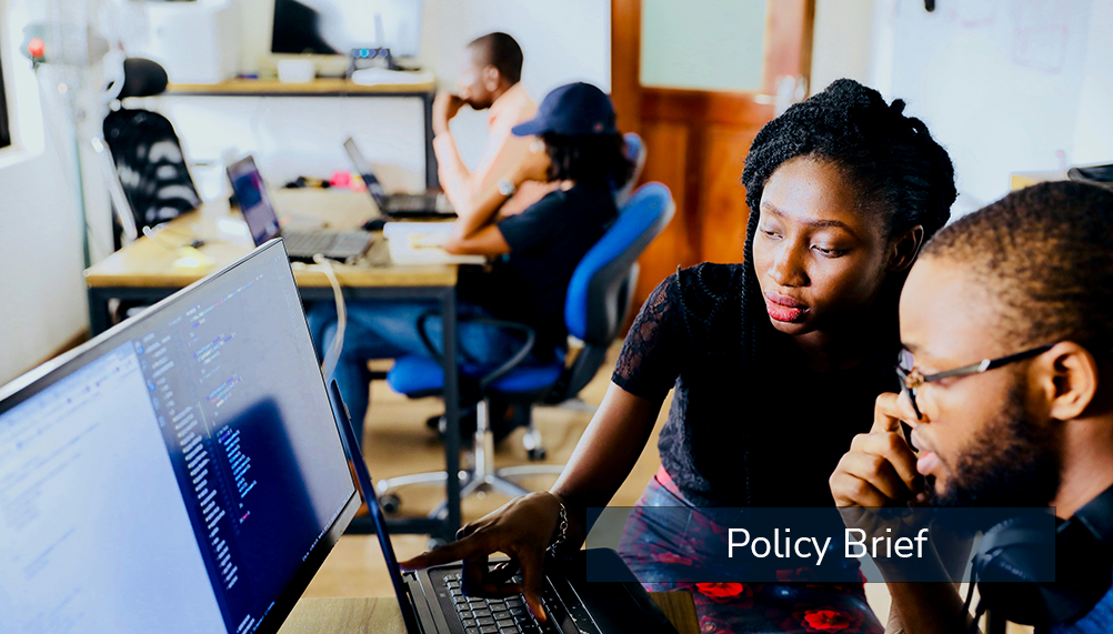 two african american students looking at a computer screen and thinking