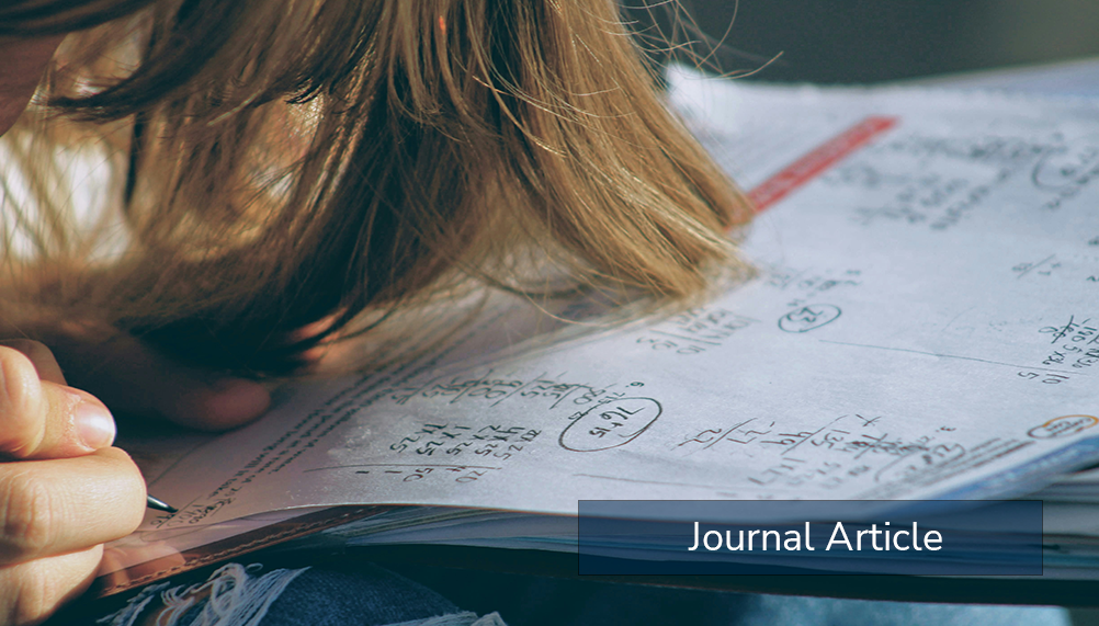 a student writing on paper