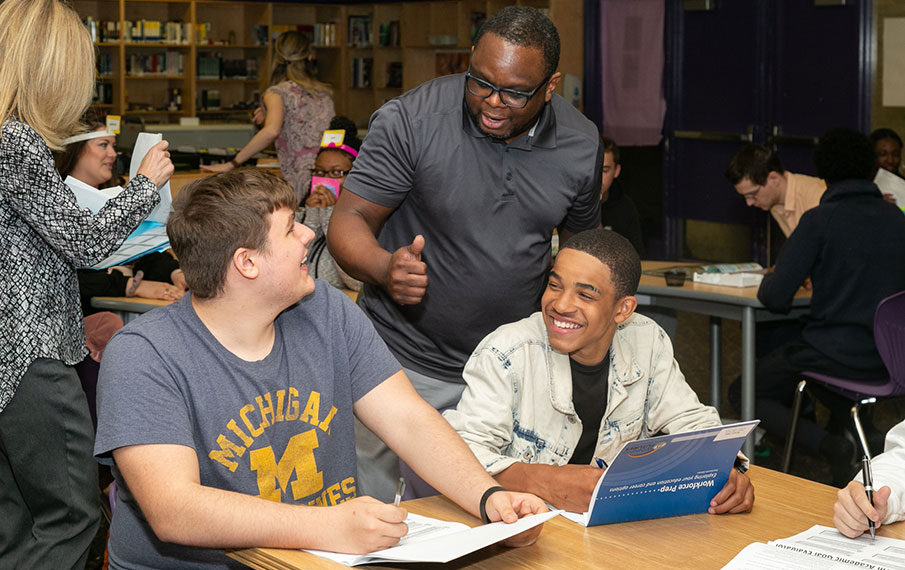 Winning Futures participants working with instructor. 